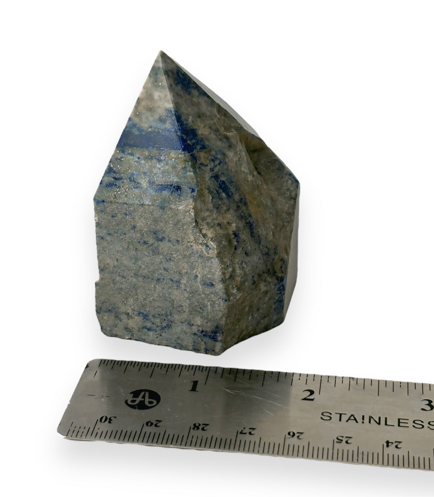 Lapis Lazuli top polished point crystal displayed with a ruler at its base, perfect for promoting mental clarity and focus in a workspace.