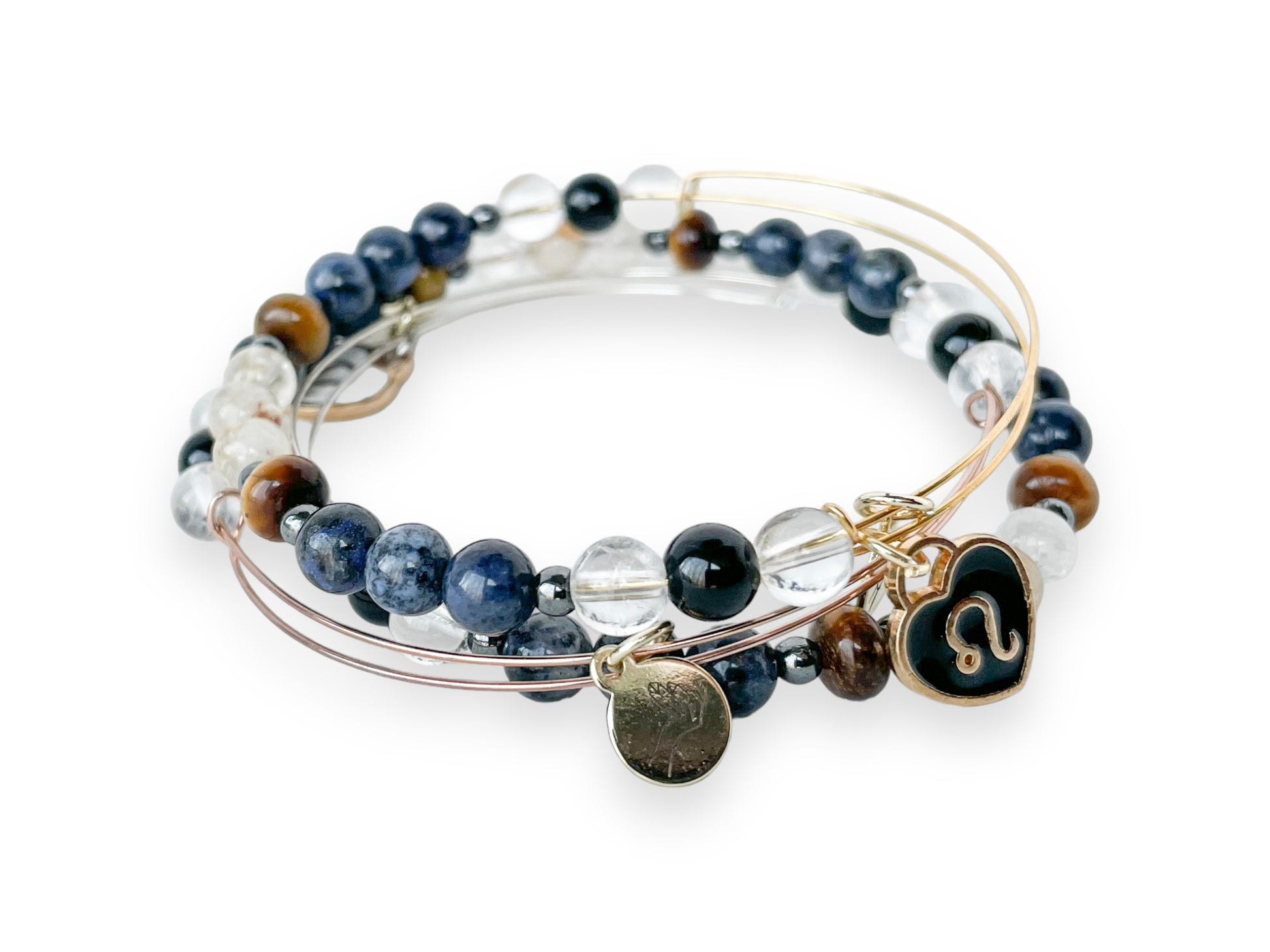 Stack of Leo Bracelets, illustrating the blend for empowerment and style.