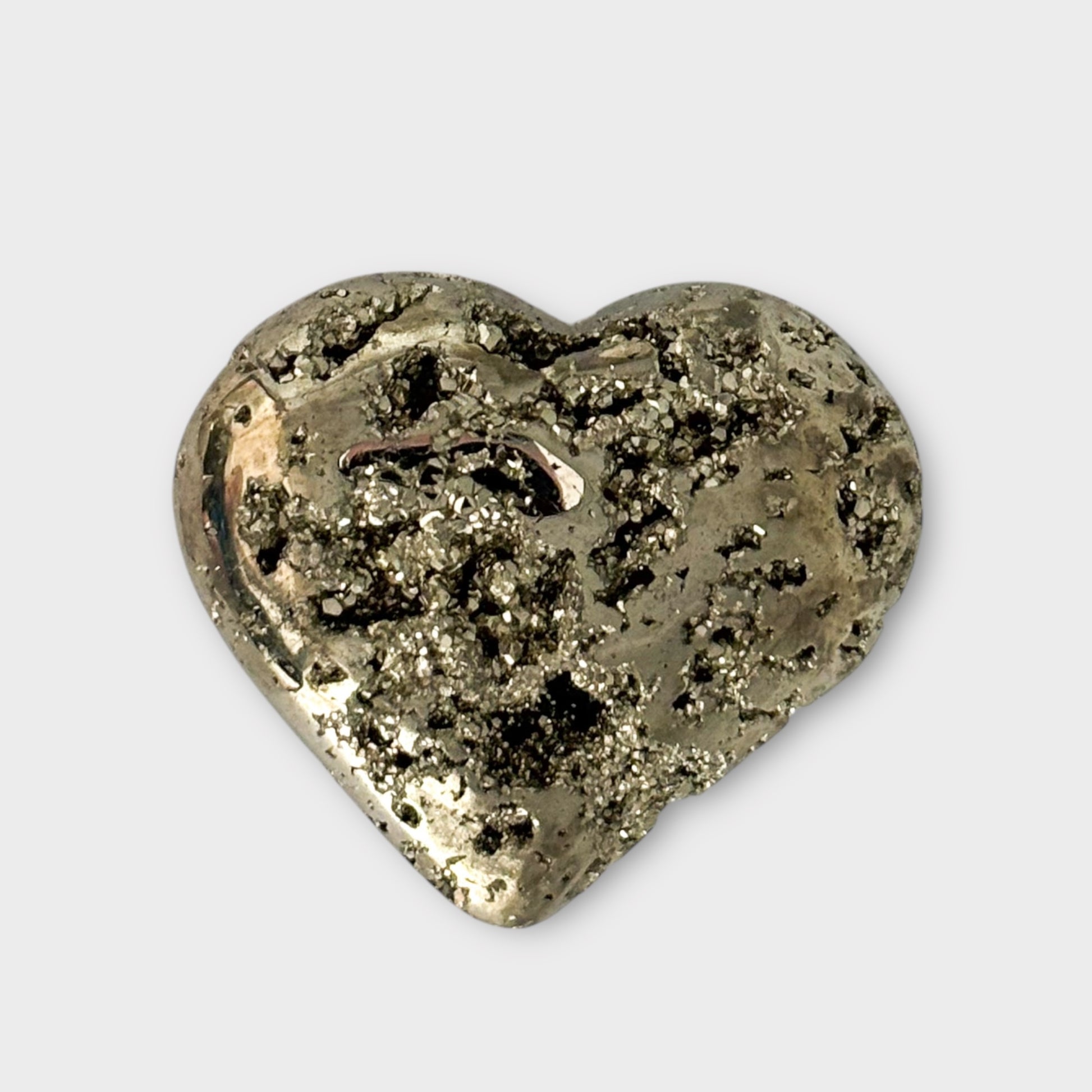 A single Pyrite Heart on a white background, showcasing its compact size and brilliant golden sparkle.