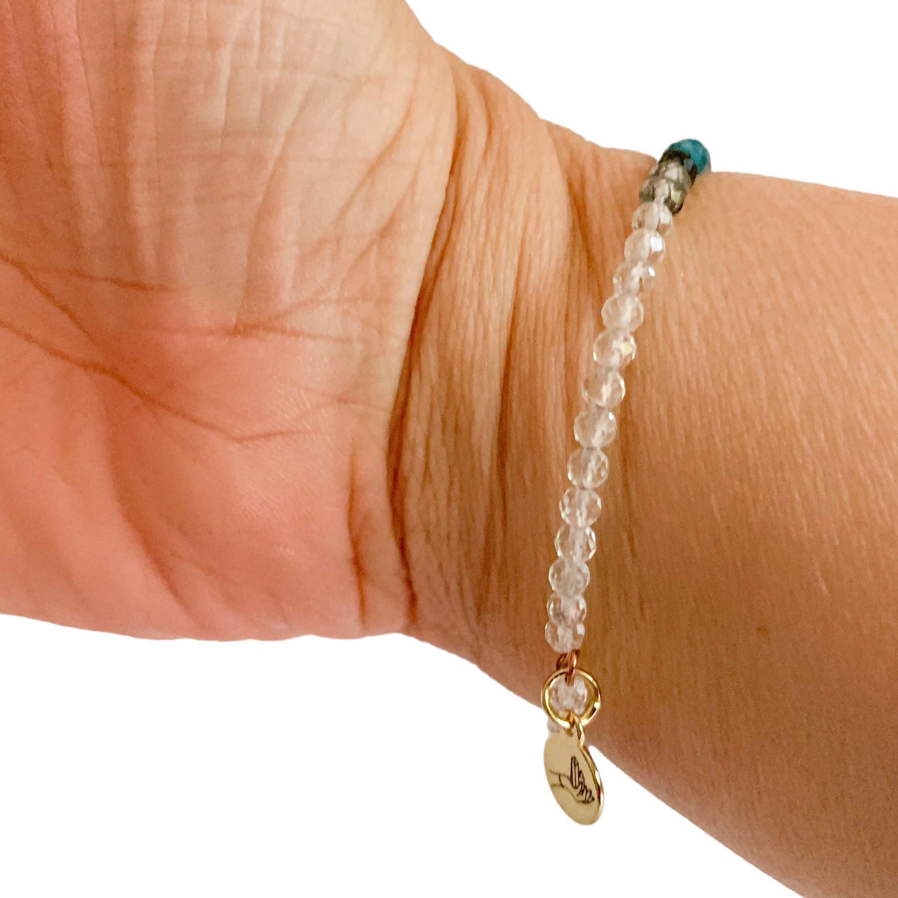 Person wearing Serenity Wrap Bracelet for peace and intention