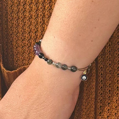 Woman wearing the Protection Crystal Bracelet, a stylish and powerful piece for grounding and energy protection.