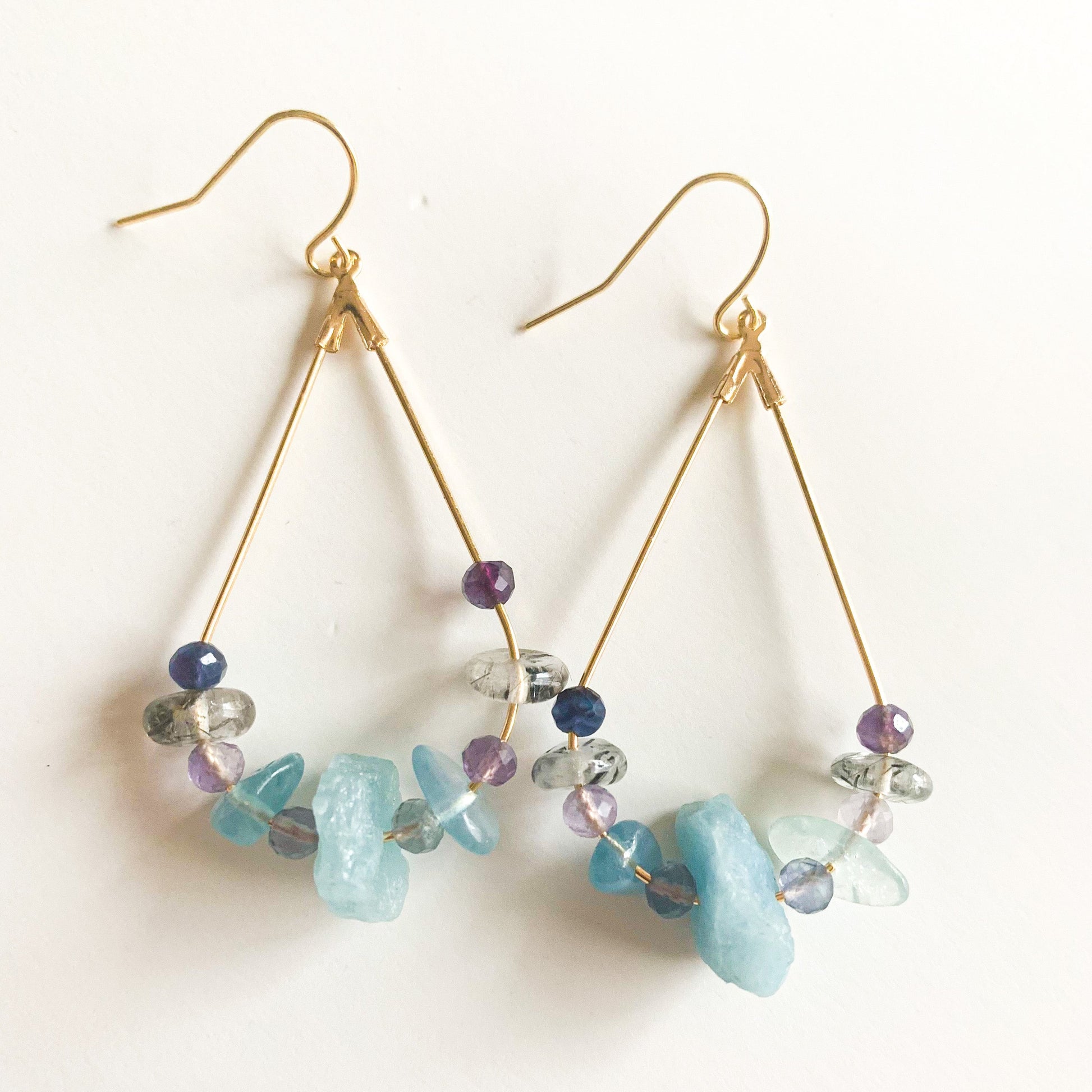 Stylish gold teardrop earrings with gemstones
